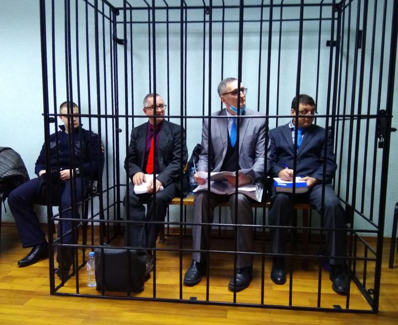 Vladimir Piskarev, Vladimir Melnik and Artur Putintsev were kept in a cage during their trial in Oryol